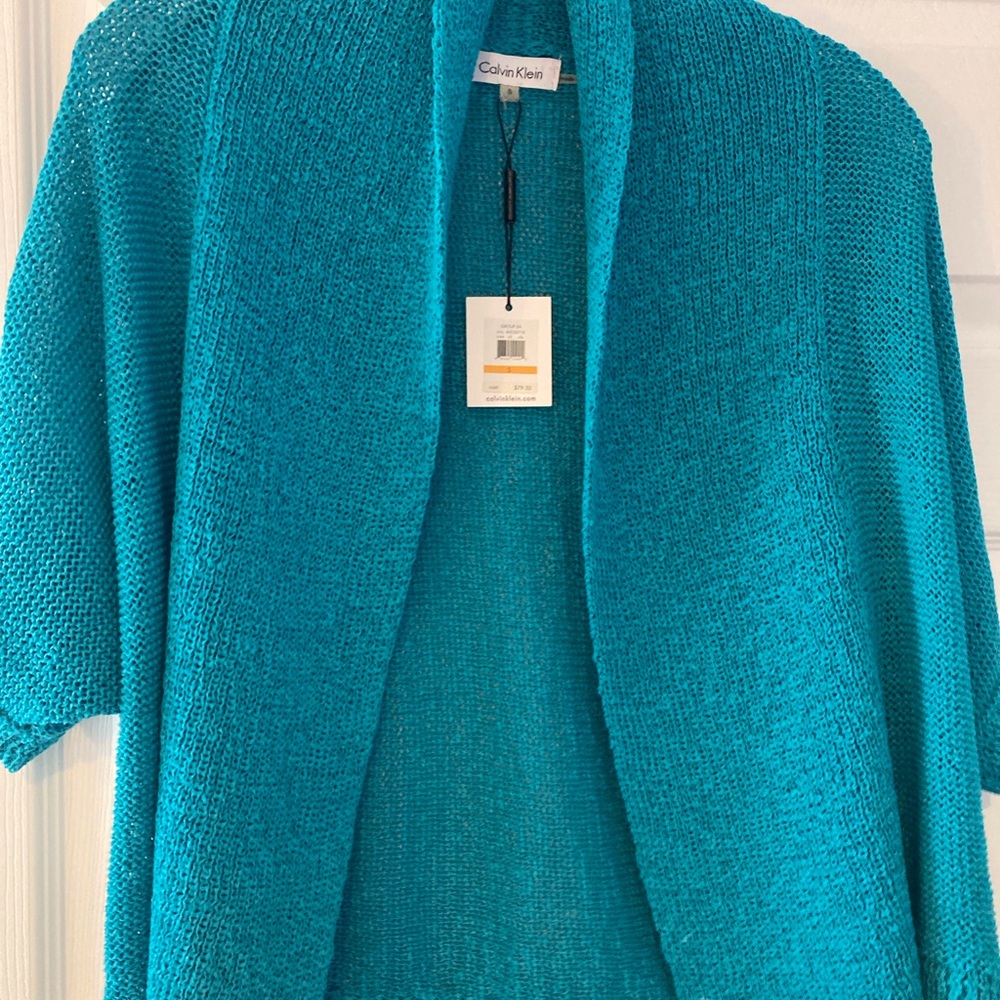 NWT Calvin Klein, Size Small. Jewel toned, vibrant shrug/short sleeve sweater